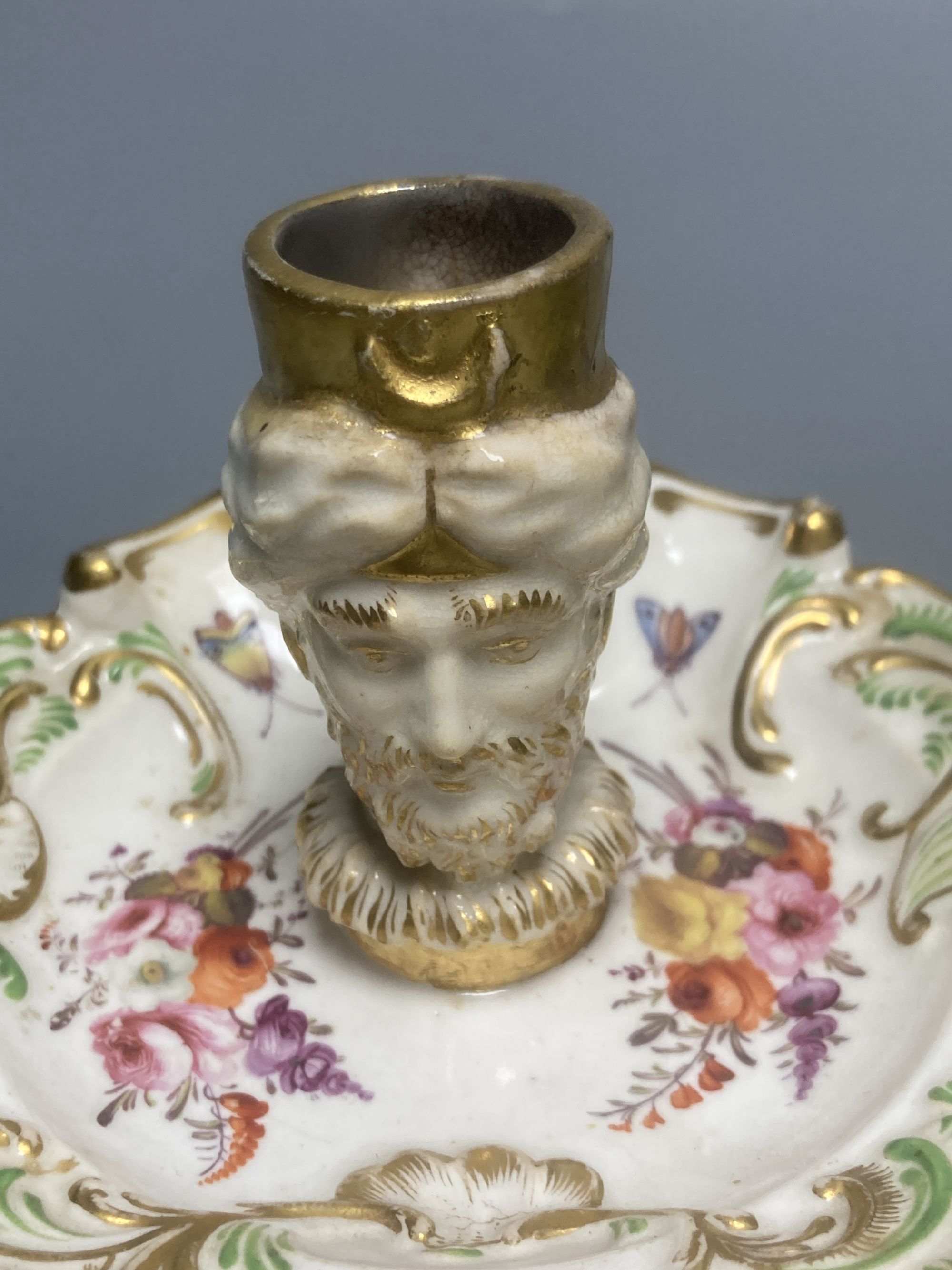 An English porcelain watch stand, probably Ridgway c.1830 and a Coalport style 'Turk's head' chamberstick (lacking handle)